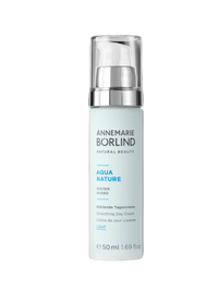 Skincare bottle with 'Annemarie Borlind' branding on a black background