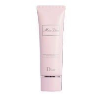 Pink Dior skincare tube on a black background