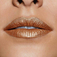 Open Maybelline Metallic Foil Lipstick in 90 Trident highlighting the bold metallic shade, smooth lipstick texture, and sleek signature packaging