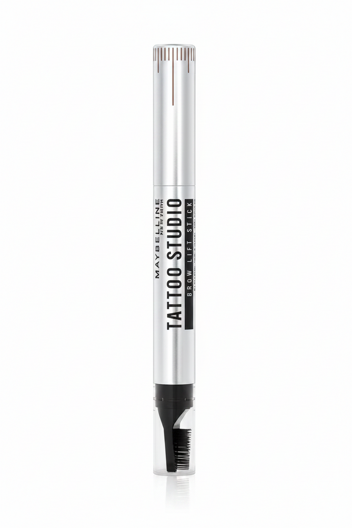 Maybelline Tattoo Brow Lift Stick in 02 Soft Brown featuring a brow styling stick with a creamy formula for shaping, filling, and defining brows.